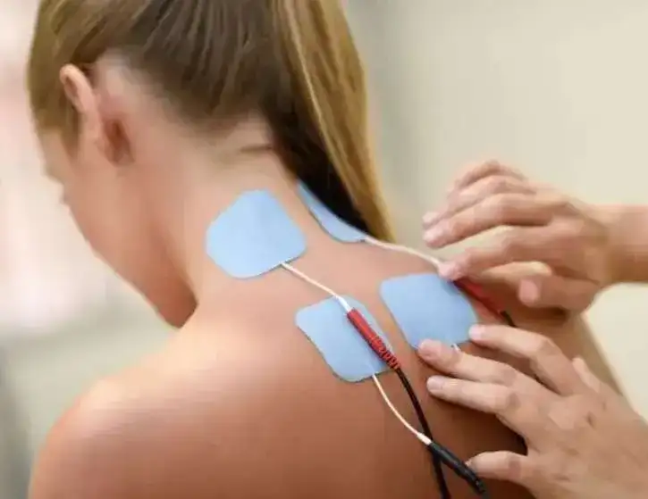 electro stimulation physical therapy young woman